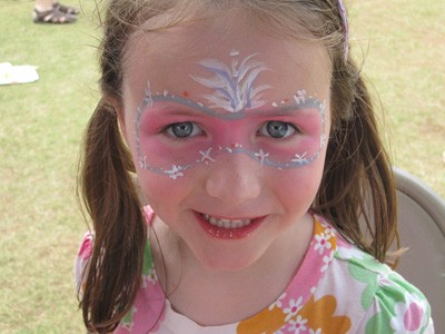Little girl with pink face paint