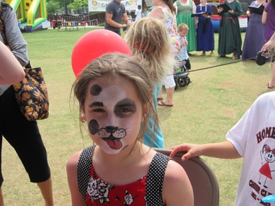 Little girl with puppy dog face paint