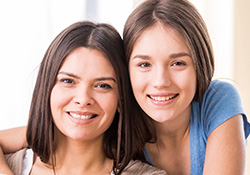 Two young women smiling together