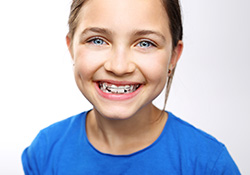 Little girl with orthodontic appliance