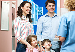 Mother father and two children at dentist