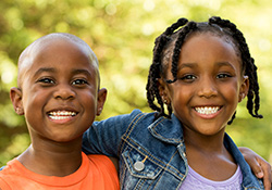 Young boy and girl hugging each other