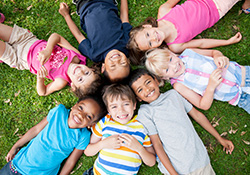 Group of kids smiling together outdoors