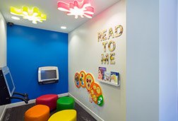 Child playing video games in waiting area