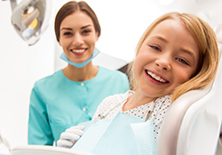 Smiling little girl in dental chair