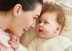 Mother smiling at infant