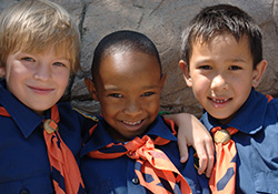 Three boy scouts smiing together