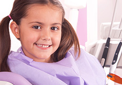 Smiling little girl in dental chair