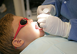 Child in dental chair receiving treatment